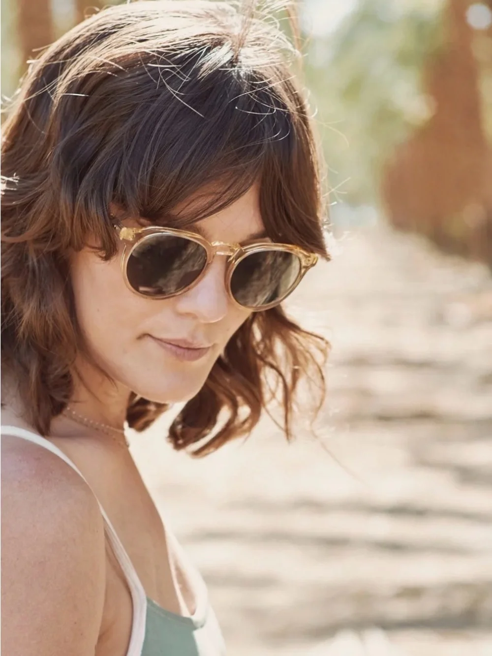 RAEN Remmy Sunglasses in champagne crystal with Dark Green Lenses